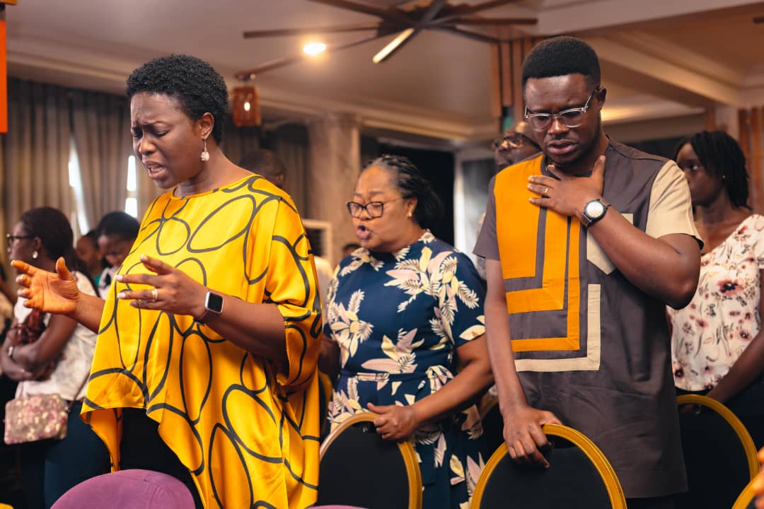 Congregants worshipping together at a Truth Unveiled Ministries gathering